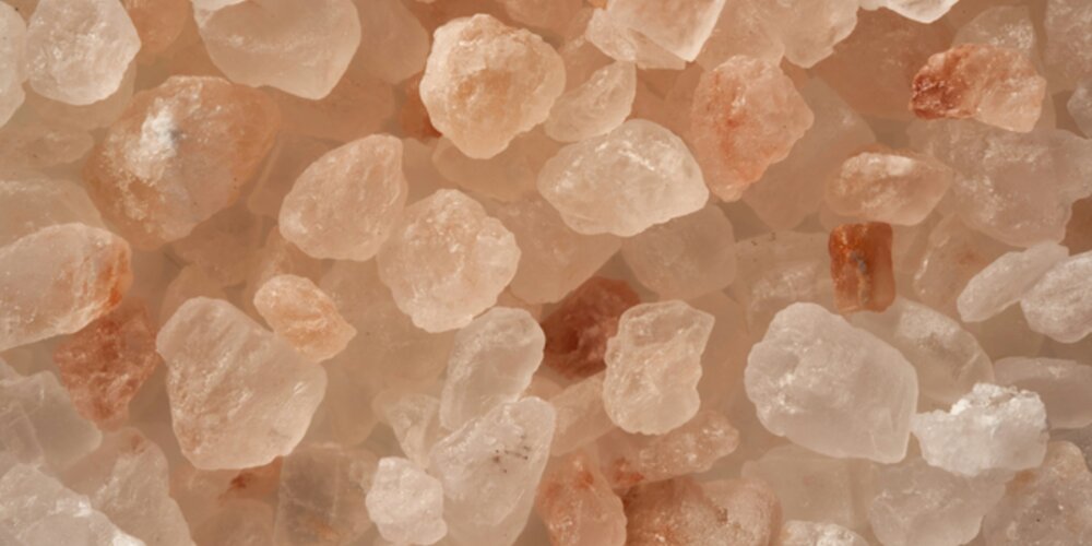 A close up of pink salt crystals.