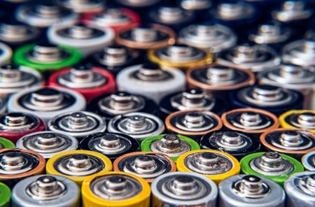 A close up to the top of batteries.