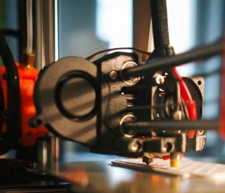 A close up of a 3D printer.